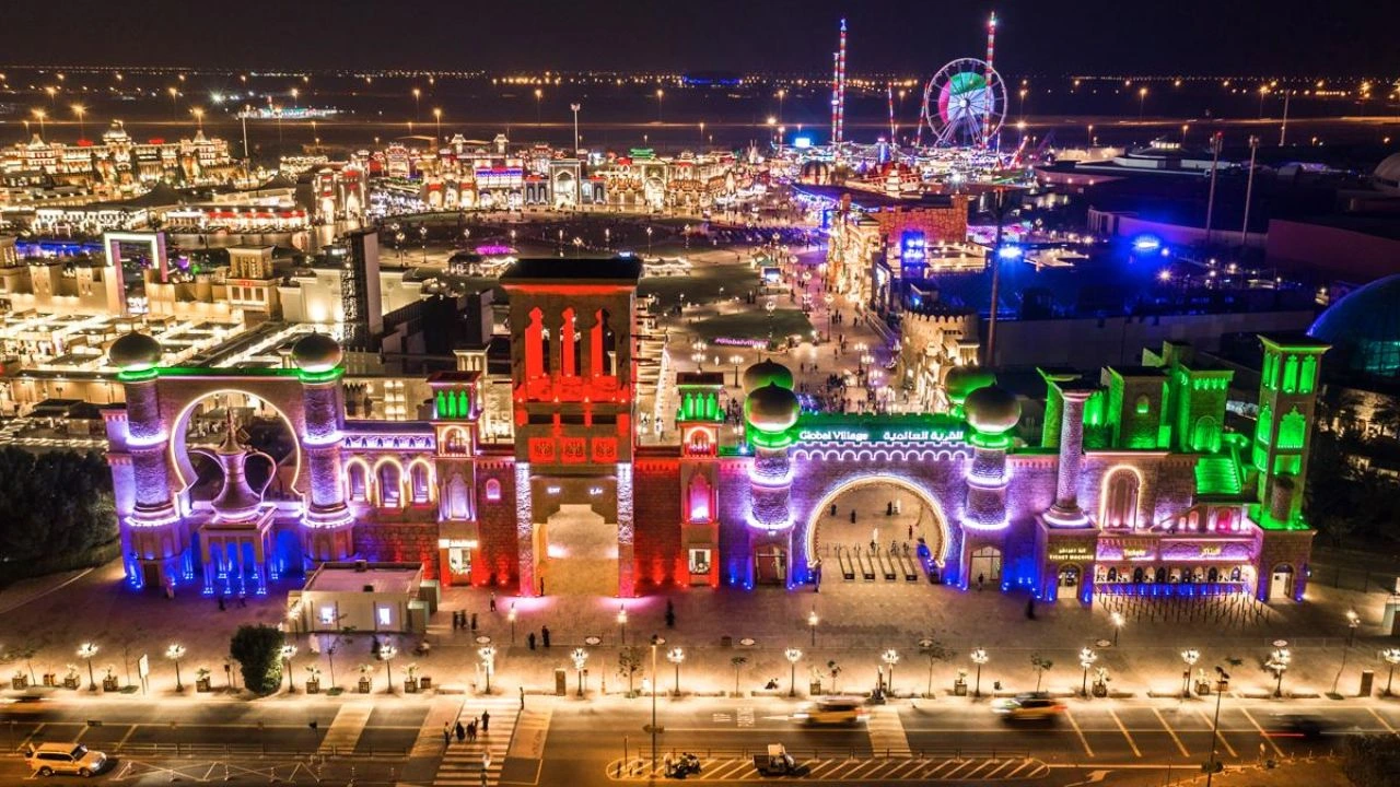 Global Village Dubai illuminated entrance at night